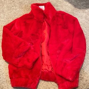 Red Faux Fur jacket. Fully lined. Super soft with front zipper.